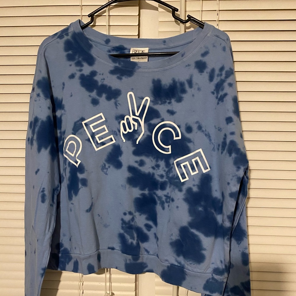 a light blue sweatshirt